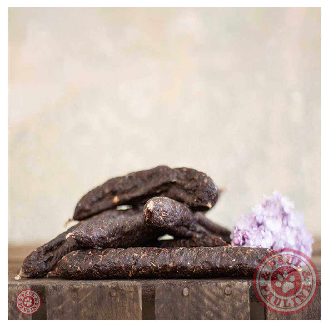 Hundesnack, Kauartikel, getrocknetes Fleisch, dunkelbraun, längliche Stücke